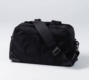 the pakt one duffel with adjustable shoulder strap in black